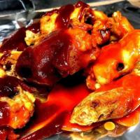 Chicken Wings · 8 to 10 (Depending on size) deep-fried chicken wings with the option of Buffalo or BBQ sauce.