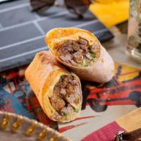 Sausage And Avocado · flour tortilla rolled up + stuffed with 2 eggs scrambled, breakfast sausage, cheddar cheese,...