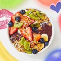 Kiwi Kiss Acai Bowl · Delicious acai blend with granola, bananas, strawberries, blueberries, kiwi, shredded coconu...