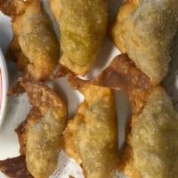Curry Puffs · Served white meat chicken, potato, curry, fried in a wonton wrapper.