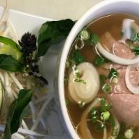 Pho Beef · Rice noodle soup with sliced beef.