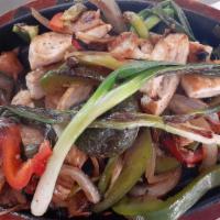 Fajitas · A Sizzling Plate with Your Choice of Chicken or Steak. Served with Sauteed Bell Peppers, Oni...