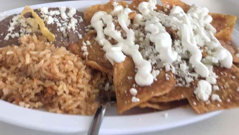 Red Chilaquiles · Fried tortilla chips on the spicy special sauce, mozzarella cheese, onions, queso fresco and sour cream. Come with potatoes or rice and beans and toast option.