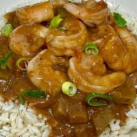 Shrimp Etouffee · Shrimp smothered in a creole brown sauce on a bed of rice.