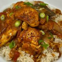 Chicken Etouffee · Chicken tenders smothered in a creole brown sauce on a bed of rice.