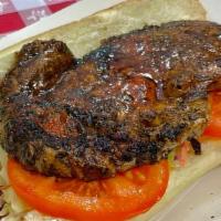 Steak Po'Boy · Steak seared in creole spices on a french roll. Comes with tomato, coleslaw, and remoulade s...