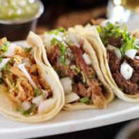 Taco Combo · 2 small tacos, choice of meat (asada, chicken or al pastor) rice and beans.
