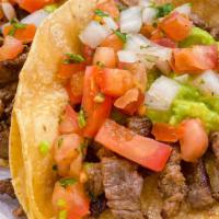 Carne Asada Taco · Marinated Grilled Steak
Topped with Guacamole and Pico de Gallo
Served on Corn Tortillas