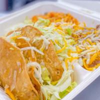 2 Beef Or Chicken Tacos · (2) Beef or Chicken Hard Tacos (Topped with Shredded Cheese and Shredded Lettuce)
Served wit...