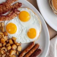 The Triple Mega Breakfast · 3 eggs* served with choice of 3 strips of Applewood-smoked bacon, 3 Johnsonville® sausage li...