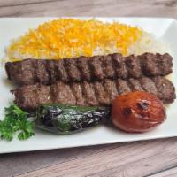 Beef Lule Kebab · Includes rice, salad, grilled jalapeño, tomato, hummus, pita bread & sauce.