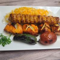 Chicken Breast Combo · Includes rice, salad, grilled jalapeño, tomato, hummus, pita bread & sauce.