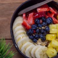 The Patriot Bowl · Organic Granola, Bananas, Strawberries, Blueberries, Coconut Shavings, and Honey.