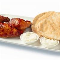 Half Chicken · Our delectably savory Rotisserie Chicken, served with 2 pita breads and 2 garlic sauces.