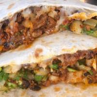 Chorizo Quesadilla · Hand Made Flour Tortilla, Cheese, Pork Chorizo, and Choice of Salsa, Onions & Cilantro