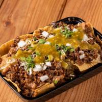 Carnitas Nachos · Tortilla Chips, Freshly Made Re Fried Beans, Carnitas, Cheese and Choice of Salsa, Onions & ...