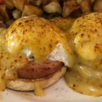Classic Egg Benedict · Poached eggs, english muffin, canadian bacon, hollandaise