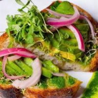 Avocado Toast · Thick sourdough slice, sprouts, pickled onions & cucumber, arugula pesto