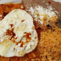 Chilaquiles And Eggs · These plates are served with rice and beans or potatoes and beans and tortillas.