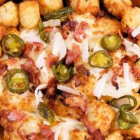 Loaded Tots · Tots smothered in cheese, bacon, onions, and jalapeños. Served with a side of zesty red sauc...
