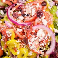 Signature Greek Salad · Crisp romaine lettuce, fresh tomatoes, red onions, feta cheese, cucumbers, Kalamata olives, ...