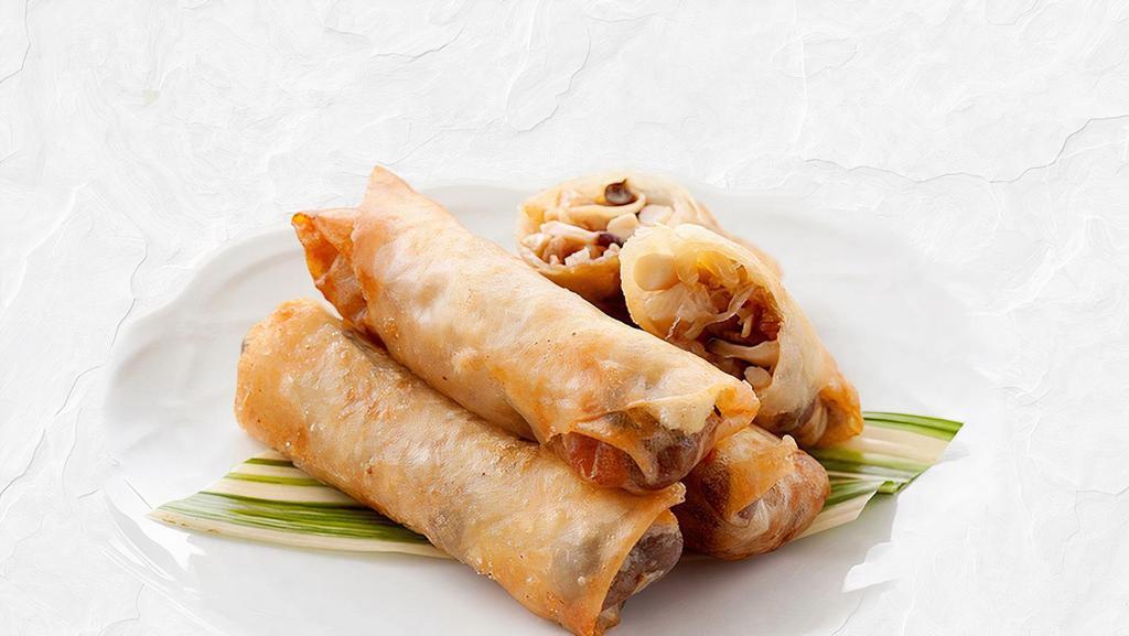 Vegetable Spring Rolls (4 Pieces) · Vegetarian. 100% vegetarian. Cabbage, green bean, carrots, mushroom, onions, vermicelli, tofu bean curd wrapped in egg roll wrap. Served with sweet chili sauce.