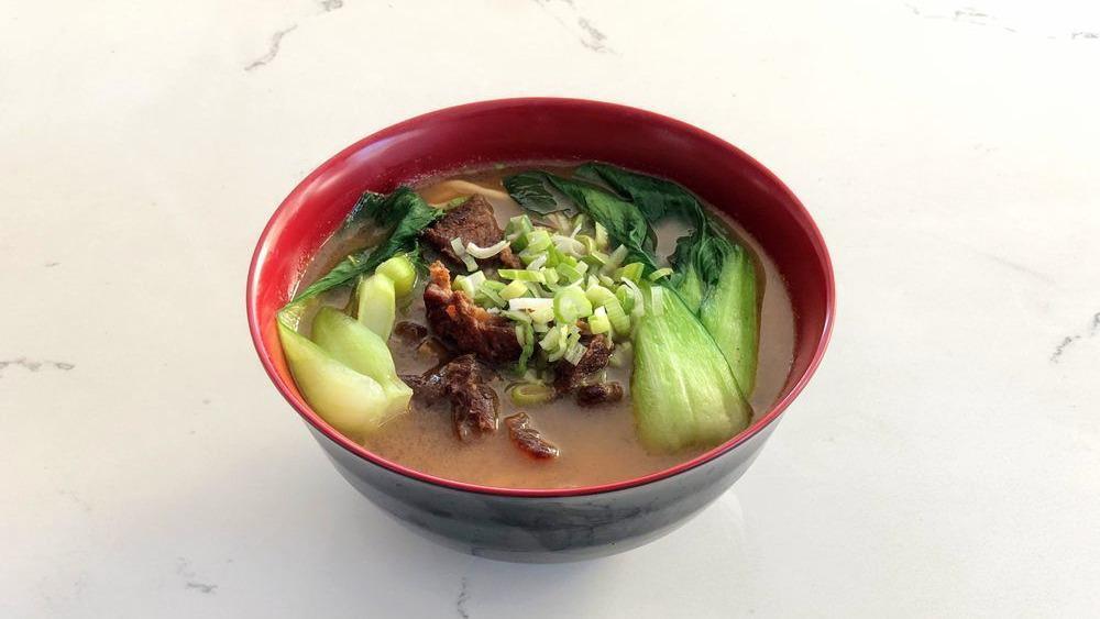 Beef Noodle Soup · Boiled noodles with braised beef shank, baby bok choy.