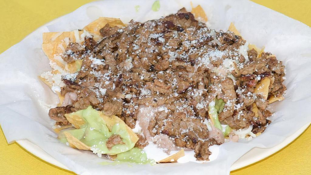 Carne Asada Taco · Guacamole and pico de gallo.