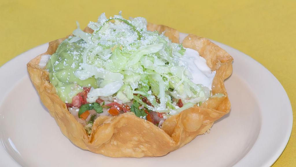 Taco Salad Tostadas · Your choice of meat, sour cream, and guacamole.