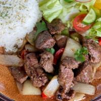 Shaken Beef · Marinated fillet mignon beef cubes, onion and bell peppers, served with white rice
