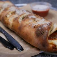 Stromboli · Baked Roll.  pepperoni, mozzarella, ham, red onions, green peppers, parmesan, garlic. served...