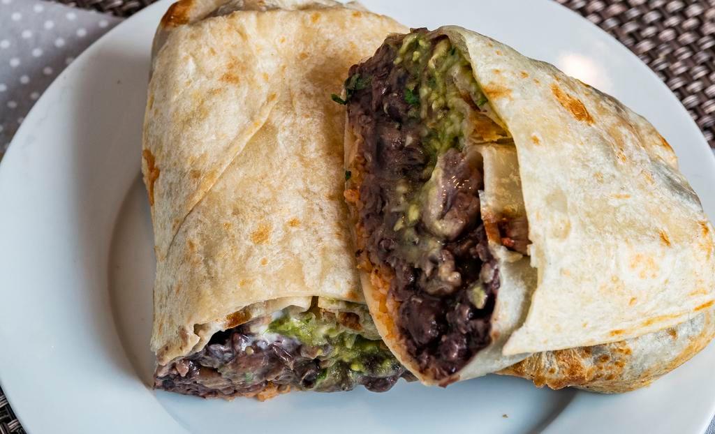 Super Burrito​ · Black beans, rice, pico, Jack cheese, sour cream, guacamole,  and  Choice of meat.