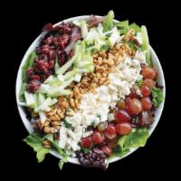 Harvest Salad · Salata mix greens, grapes, apples, dried cranberries, feta cheese, walnuts, and pesto chicke...