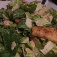 Caesar Salad · With romaine, teardrop tomatoes, red onions, Sicilian white anchovies, parmigiano reggiano, ...