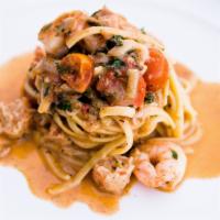 Linguini With Lobster · Lobster, manila clams, cherry tomatoes, garlic, chili's, fresh herbs, and brandy finished wi...