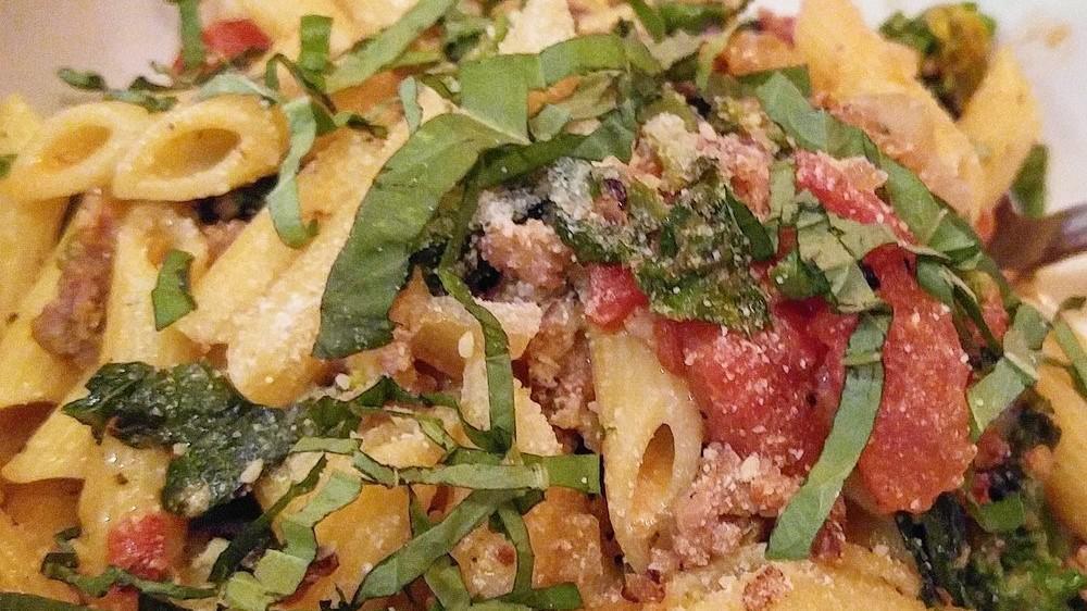 Penne Pasta With Sausage & Rapini · Spicy Italian sausage, shallots, garlic, fresh herbs, anchovy, and white wine finished with butter and basil.