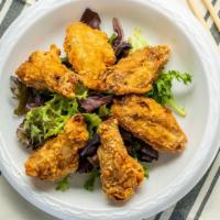 #21 Chicken Wings · Lightly breaded chicken wings fried to perfection, crispy and tasty.