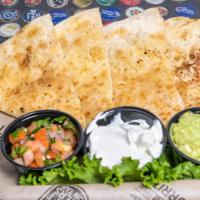 Cheese Quesadilla · Flour tortilla filled with monterey jack cheese and grilled to perfection, served with guaca...