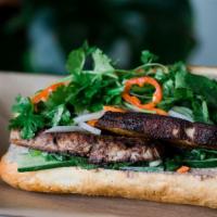 Pork Belly Banh Oui · Favorite. Served on a French roll with pickled carrot and daikon, braised pork belly, cucumb...