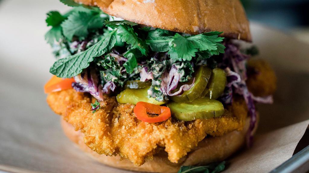 Organic Fried Chicken Sandwich · Favorite. Served on a Kaiser roll with sesame panko breaded  chicken breast, bread and butter pickles, pickled fresno, garlic purée and chicken liver pate.