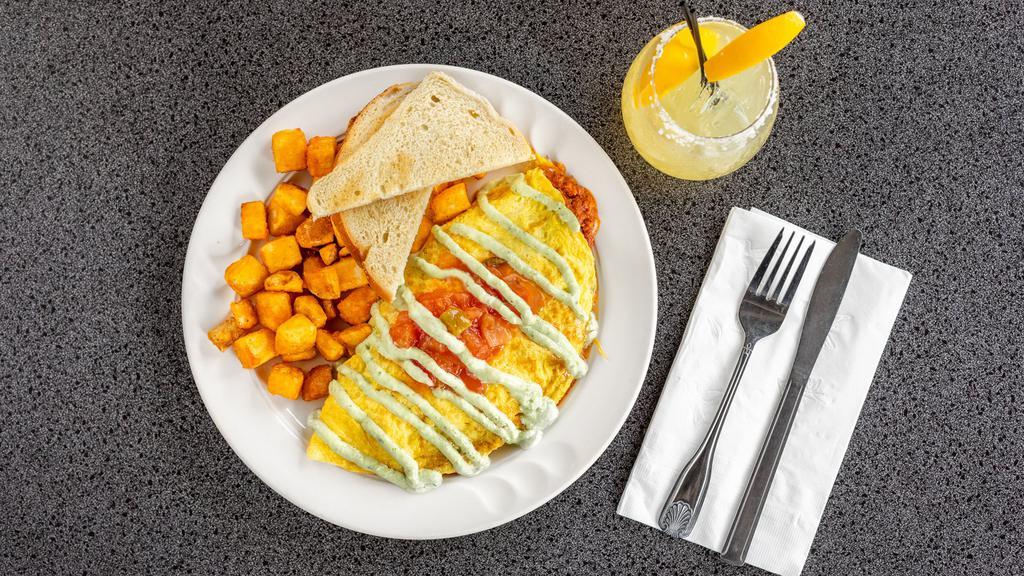 Cancun Omelette · Chorizo black bean chili, avocado pulp, jack and cheddar cheese with salsa fresca and jalapeño sour cream.
