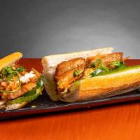 Banh Mi · Fresh baked baguette with house spread, egg, cucumber, jalapeno, pickled carrot, cilantro, g...