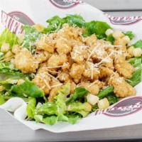 Chicken Caesar Salad Or Wrap · Fresh romaine lettuce with parmesan cheese and croutons topped with our delicious chicken te...