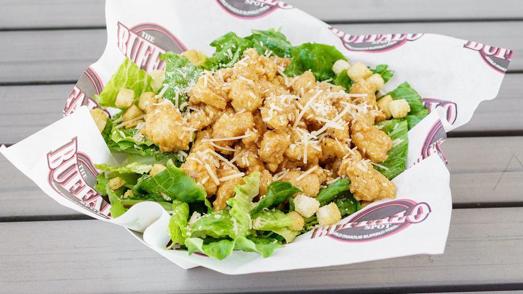 Chicken Caesar Salad Or Wrap · Fresh romaine lettuce with parmesan cheese and croutons topped with our delicious chicken tenders. Served with caesar dressing.