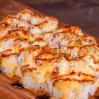 Baked Scallop Roll · Inside - crabmeat, avocado. Outside - scallop, bake sauce.