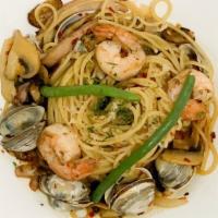 Seafood Pasta · Smoked shrimp, clam, and fresh squid with spaghetti and our signature spicy.
