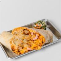 Carnivore Breakfast Burrito · Flour tortilla with scrambled eggs, bacon, sausage, ham, hash browns and cheddar cheese!