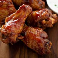 Bbq Chicken Wings · Delicious crispy wings tossed in BBQ sauce.