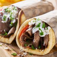 Gyro Wrap · Delicious juicy gyro meat with lettuce, onions, tomatoes, salata, tzatziki sauce all wrapped...
