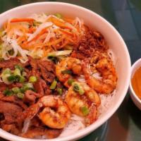 Bún Tôm Thịt Nướng · Vermicelli noodle, grilled pork, shrimp, and salad.